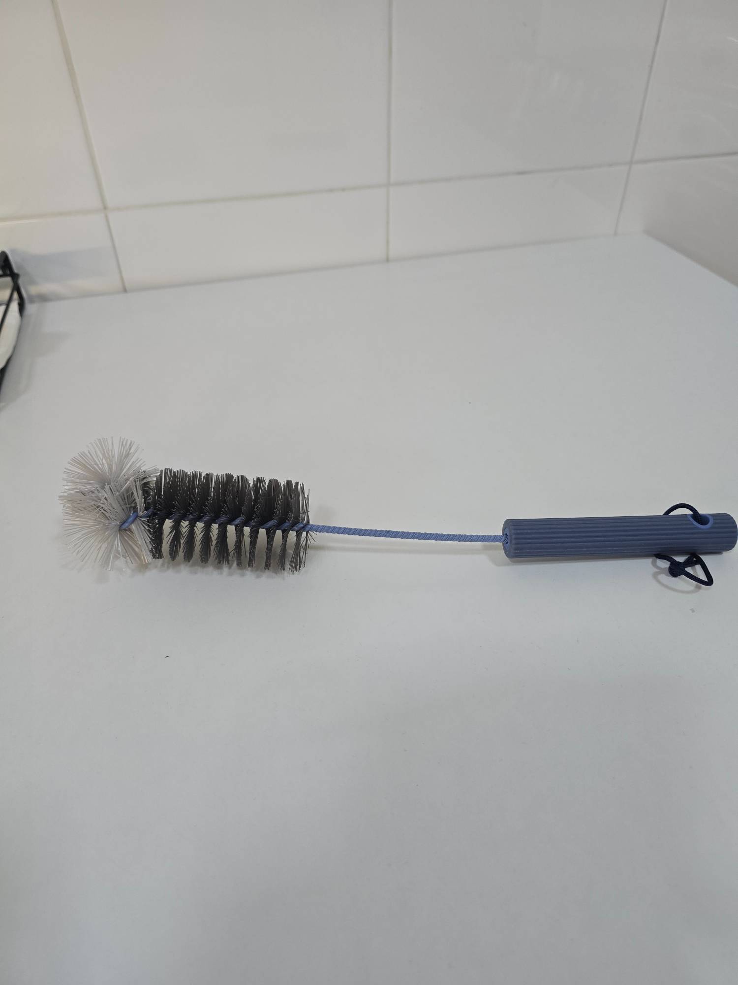 Escobilla limpia botellas